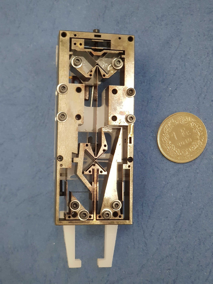 Bistable gripper grasping object